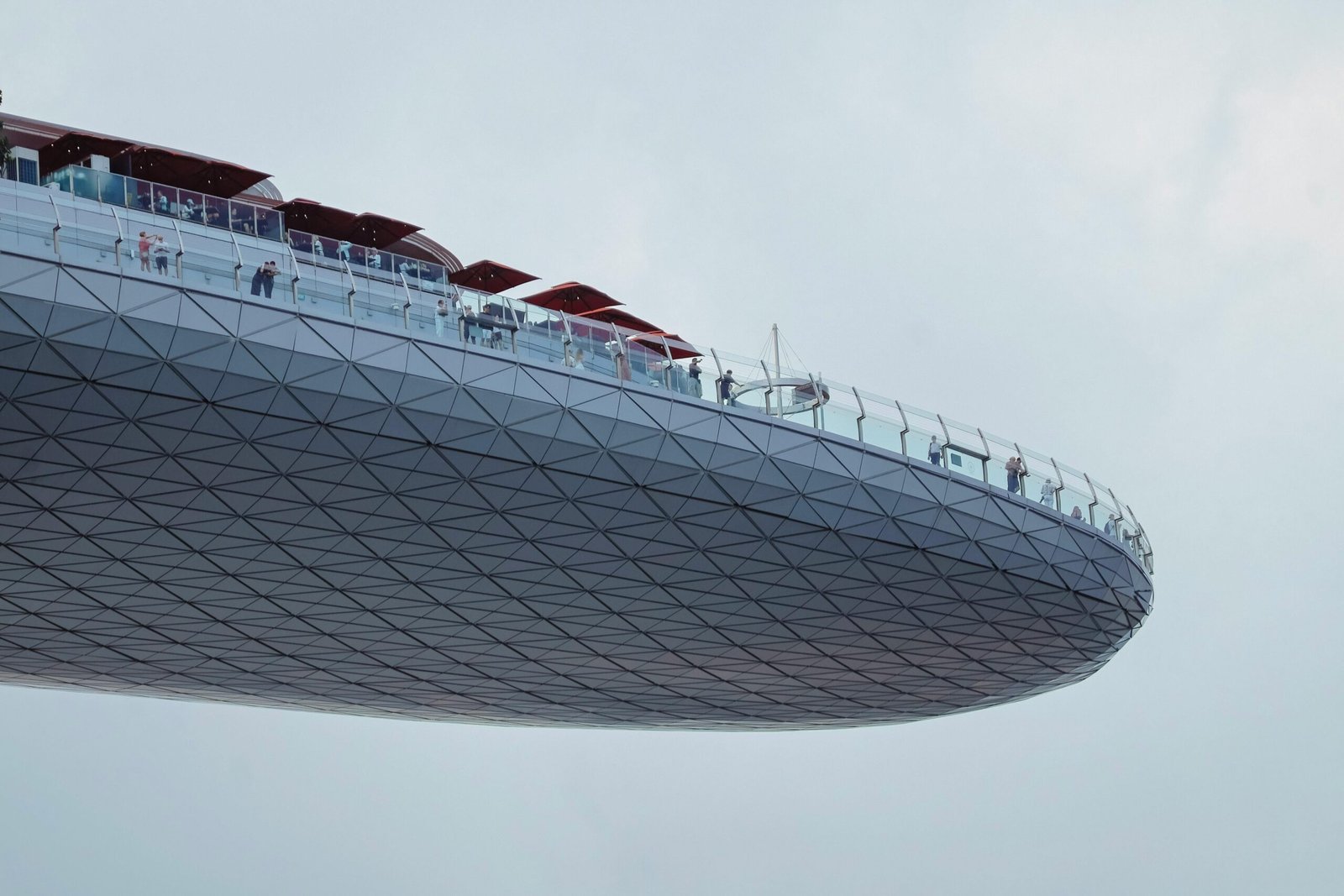 Singapore rooftop event space hosting a phygital corporate gathering, blending physical networking with digital insights and panoramic city views.